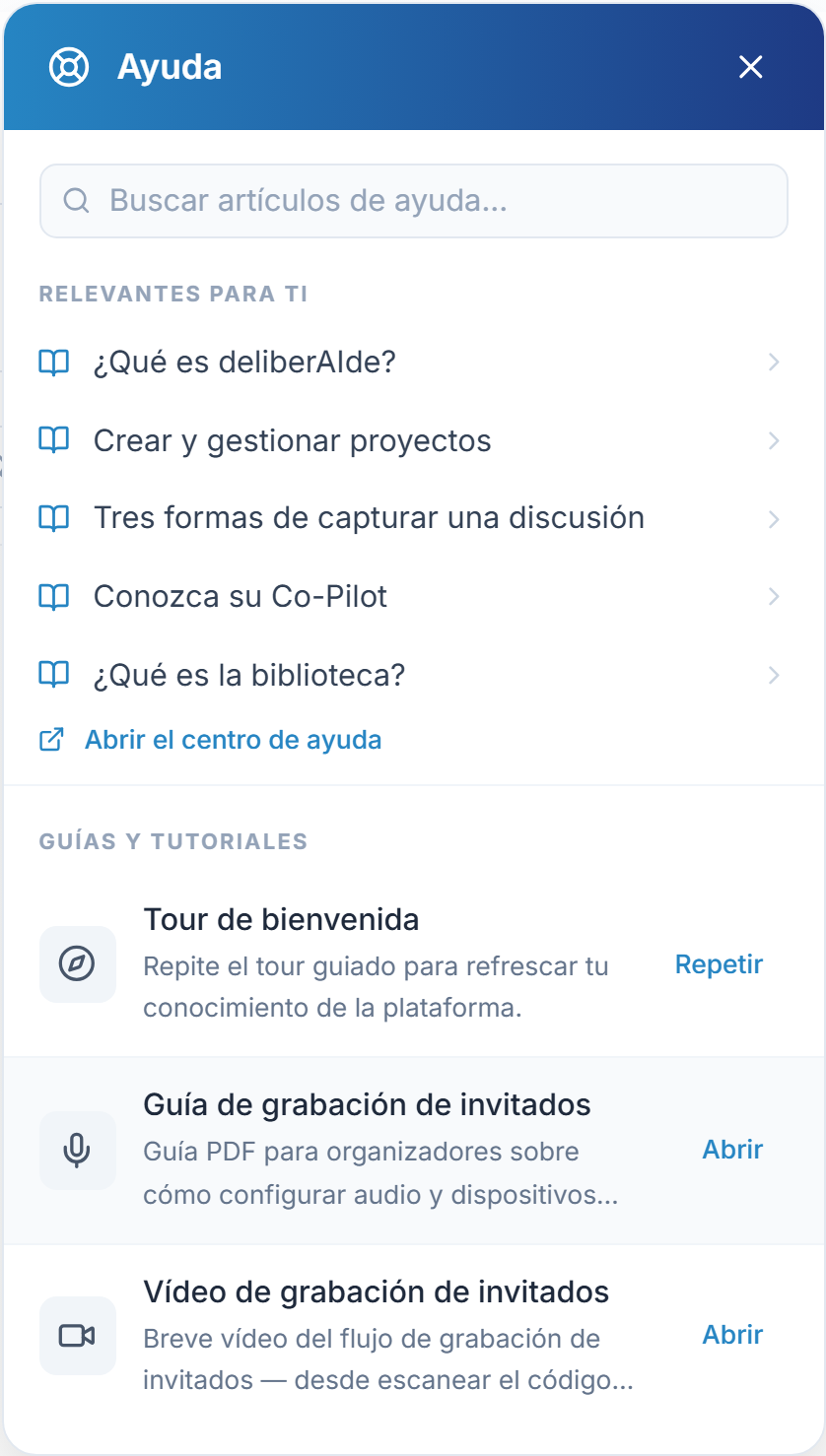 El panel de Ayuda tras el botón ?, con guías y vídeos cortos bajo Guías y tutoriales.